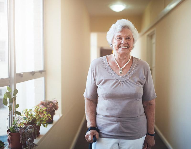 Woman Smiling and walking in hall